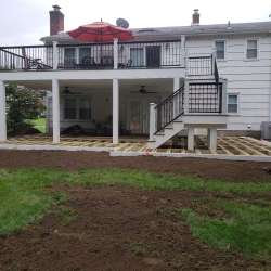 Permeable paver concrete deck tiles patio walk out basement patio installation - flood zone