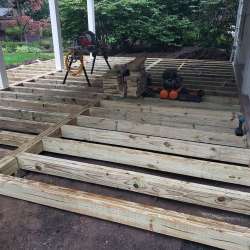 Permeable paver concrete deck tiles patio walk out basement patio installation - flood zone