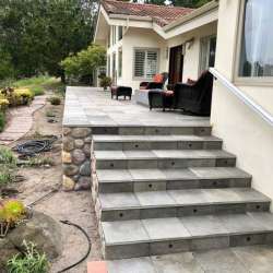 Paver stair installation - DekTek's luxury concrete deck tiles locked in on with aluminum edge trim in Pebble Beach California