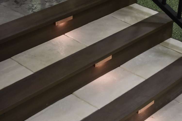 DekTek Tile concrete deck tile stairs bordered in composite decking